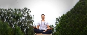 A men doing Yoga at India Yoga School.