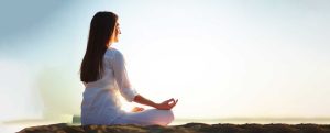 A lady doing Yoga at India Yoga School.