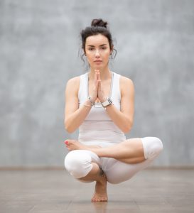 A lady doing Yoga at India Yoga School.