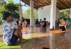 A group of people doing Yoga at India Yoga School.