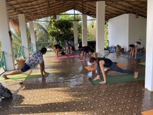 A group of people doing Yoga at India Yoga School.