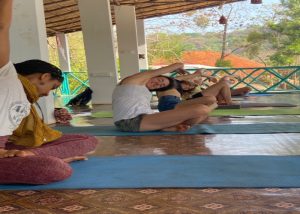 A group of people doing Yoga at India Yoga School.